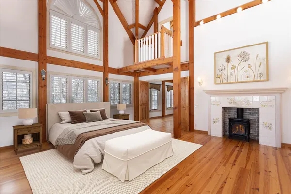 a bedroom with a bed and a fireplace