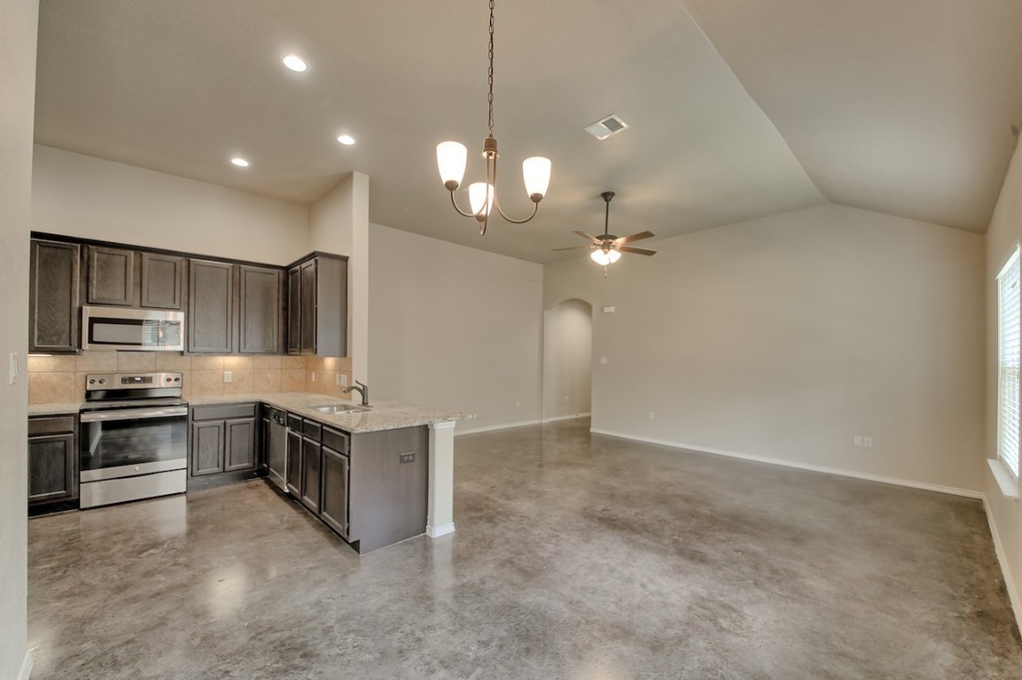 108 Samuel Drive, Unit A Buda, TX 78610 - Photo 10 of 11 a kitchen with a stove and refrigerator