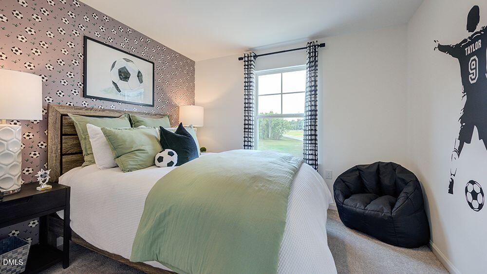 228 Hank Way Angier, NC 27501 - Photo 16 of 43 a bedroom with bed and a window