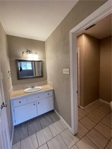 a bathroom with a toilet and a sink