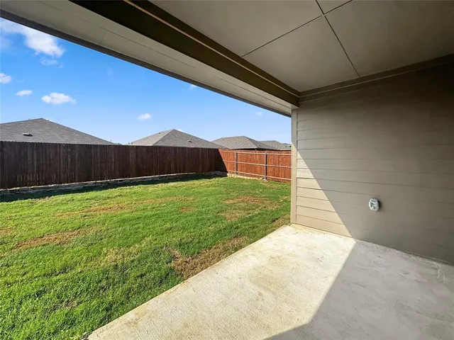 a view of balcony with yard