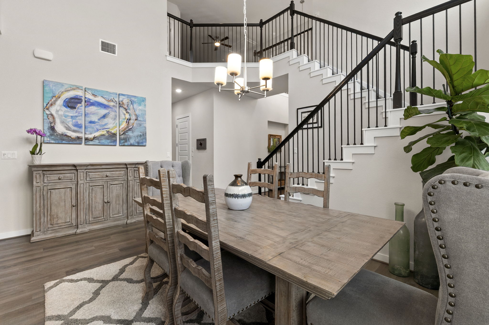 460 Constitution Way Kyle, TX 78640 - Photo 8 of 40 Dining area featuring high ceilings and wood-finish flooring