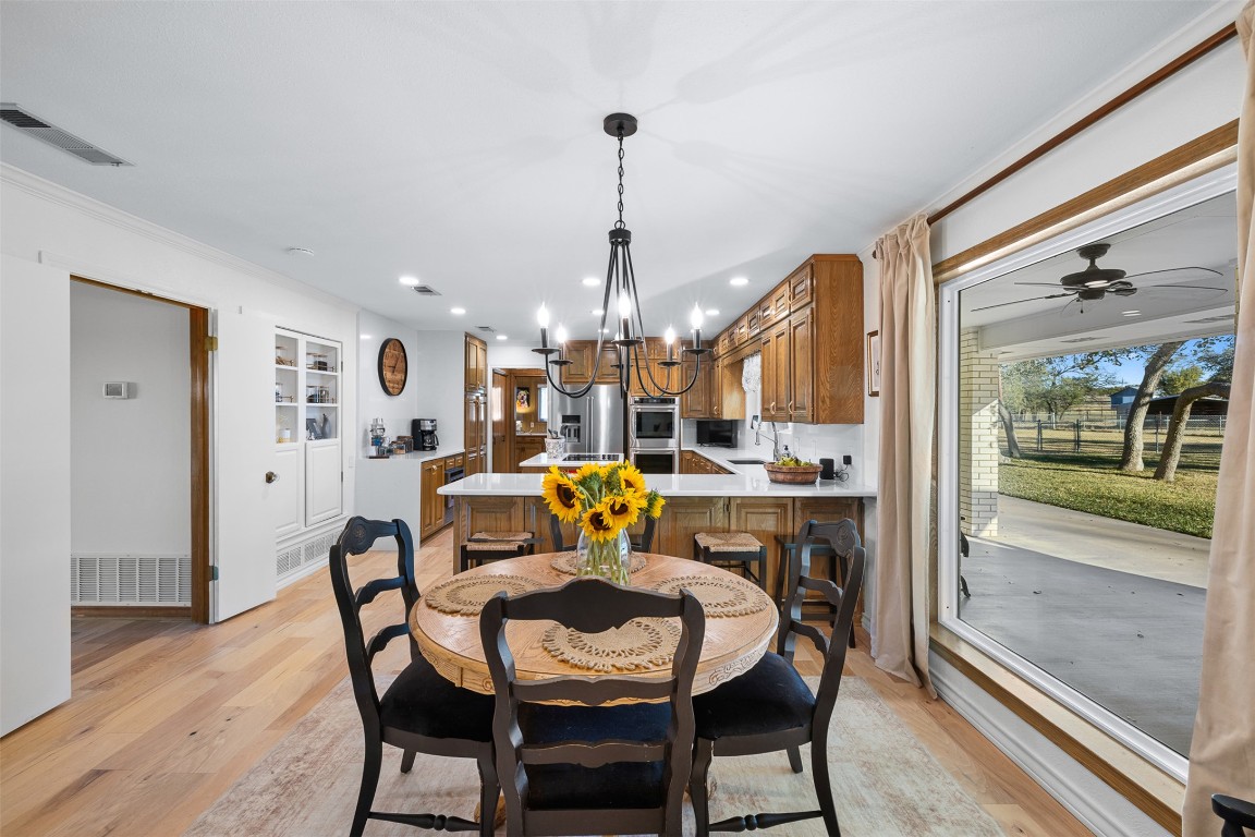 197 Live Oak Cemetery Road Killeen, TX 76542 - Photo 19 of 36 a dining room with furniture a chandelier and wooden floor