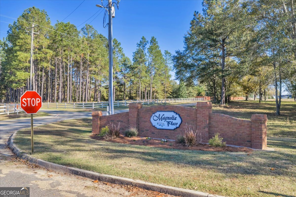 Lot 29 Sweet Magnolia Circle Dublin, GA 31021 - Photo 23 of 23 a wooden table and chairs in the patio