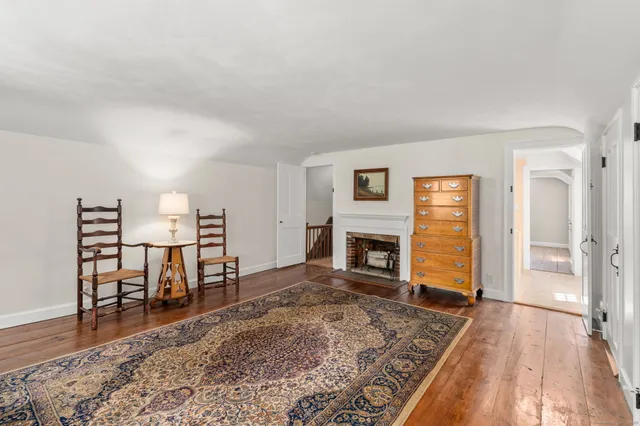 a view of a livingroom with furniture and a fireplace