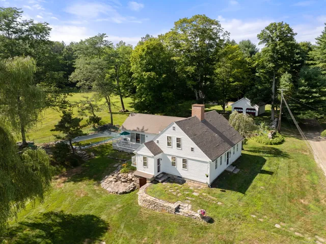 an aerial view of a house with swimming pool