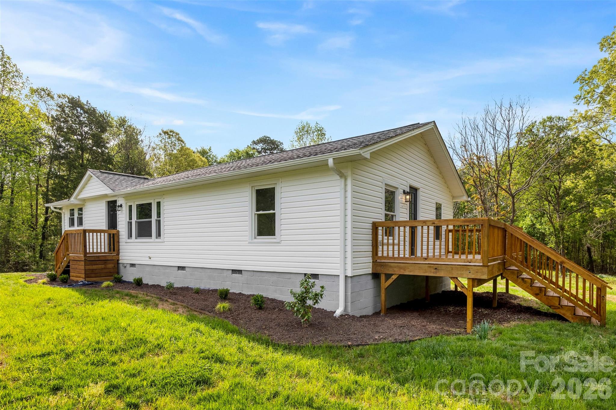 858 High Shoals Church Road Mooresboro, NC 28114 - Photo 1 of 25 a view of a house with a backyard