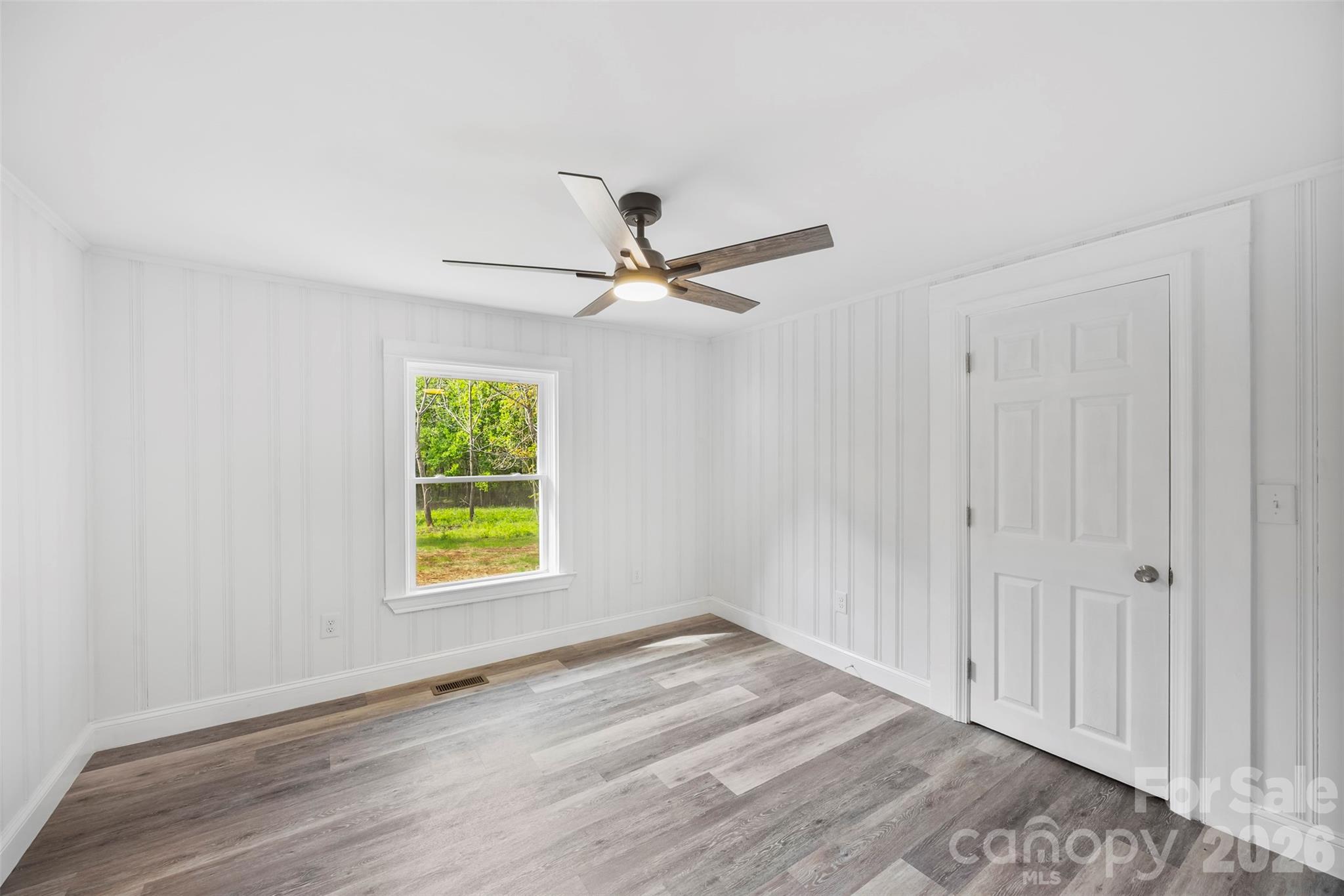 858 High Shoals Church Road Mooresboro, NC 28114 - Photo 14 of 25 wooden floor in an empty room with a window