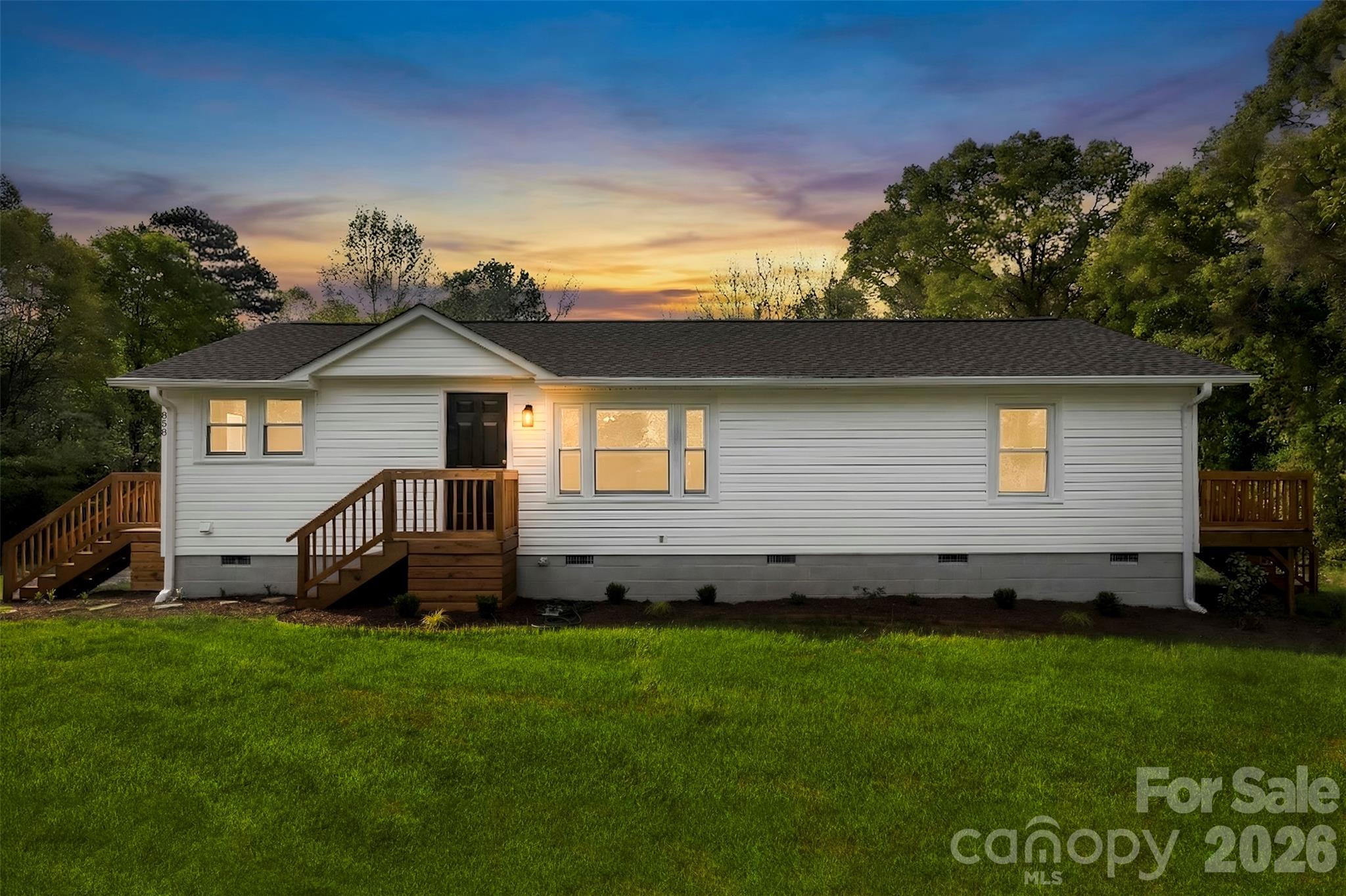 858 High Shoals Church Road Mooresboro, NC 28114 - Photo 25 of 25 a front view of a house with a garden