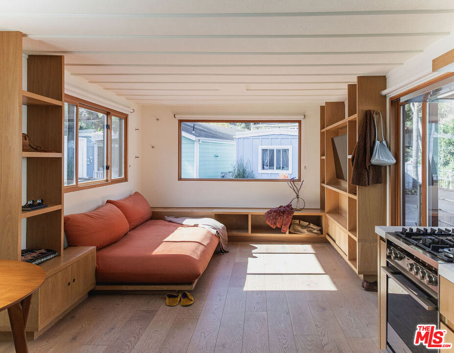 a bedroom with furniture and a window