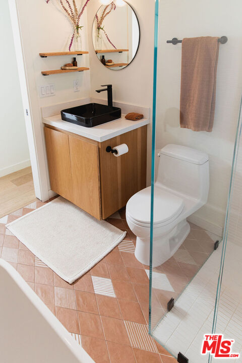 43 Paradise Cove Road Malibu, CA 90265 - Photo 7 of 21 a kitchen with a stove a sink and a refrigerator