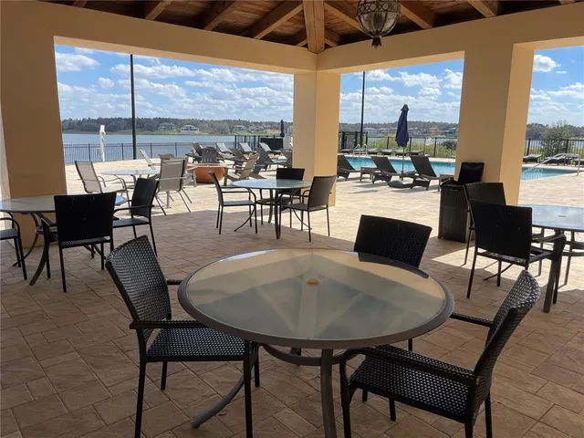 a view of a dining room with furniture window and outside view