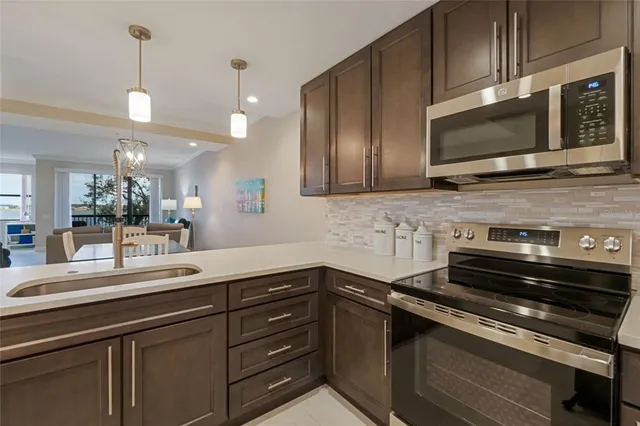 a kitchen with a sink and microwave