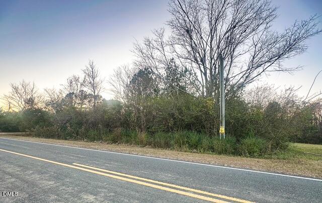 1037 Reed Road Castalia, NC 27816 - Photo 9 of 18 a view of a yard and basketball court