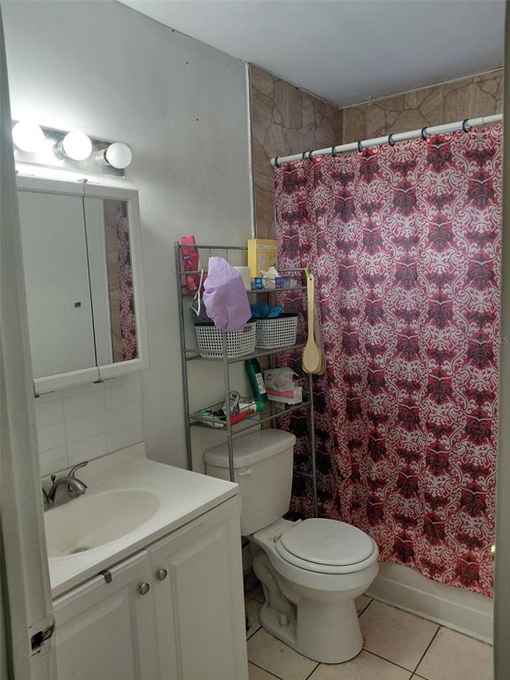 5924 Pine Street New Port Richey, FL 34652 - Photo 13 of 20 a bathroom with a sink toilet and shower