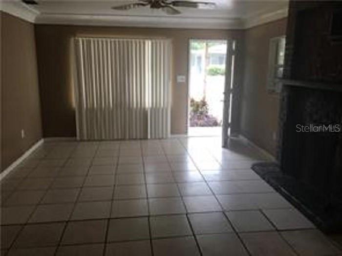 5924 Pine Street New Port Richey, FL 34652 - Photo 18 of 20 a view of a livingroom with an empty space and a window