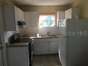 5924 Pine Street New Port Richey, FL 34652 - Photo 4 of 20 a room with sink cabinets and window