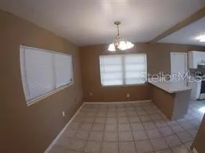 a view of entryway with kitchen