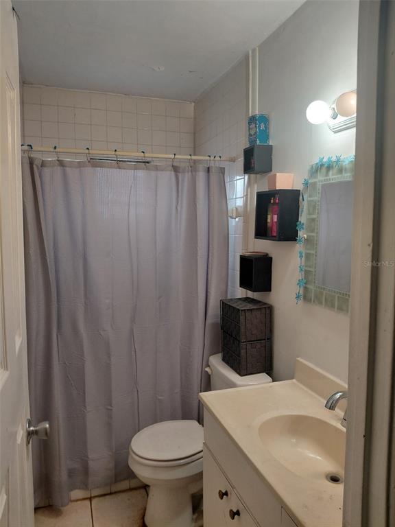 5924 Pine Street New Port Richey, FL 34652 - Photo 7 of 20 a bathroom with a sink toilet and shower