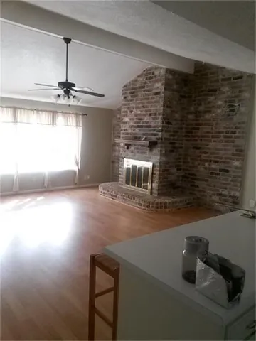 a kitchen with stainless steel appliances a refrigerator and a stove top oven