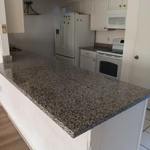 a bathroom with a shower and toilet