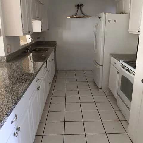 a view of backyard with entertaining space