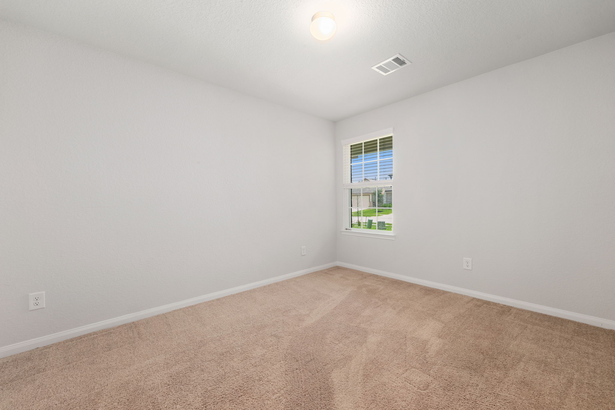 17555 Greystanes Road Humble, TX 77346 - Photo 20 of 28 an empty room with windows