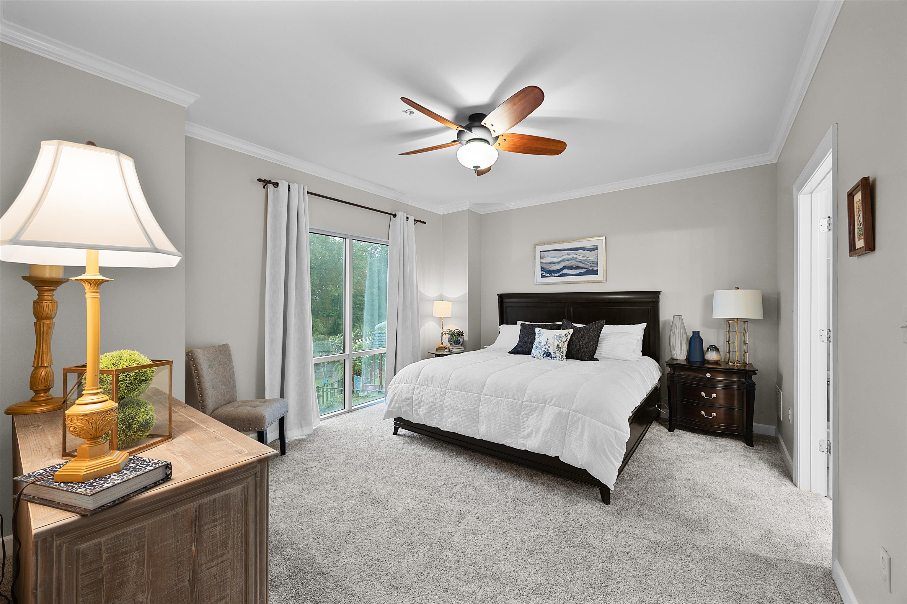 25 Cr 380 Road, Unit P 204 Iuka, MS 38852 - Photo 12 of 19 Bedroom featuring light colored carpet, crown molding, and ceiling fan