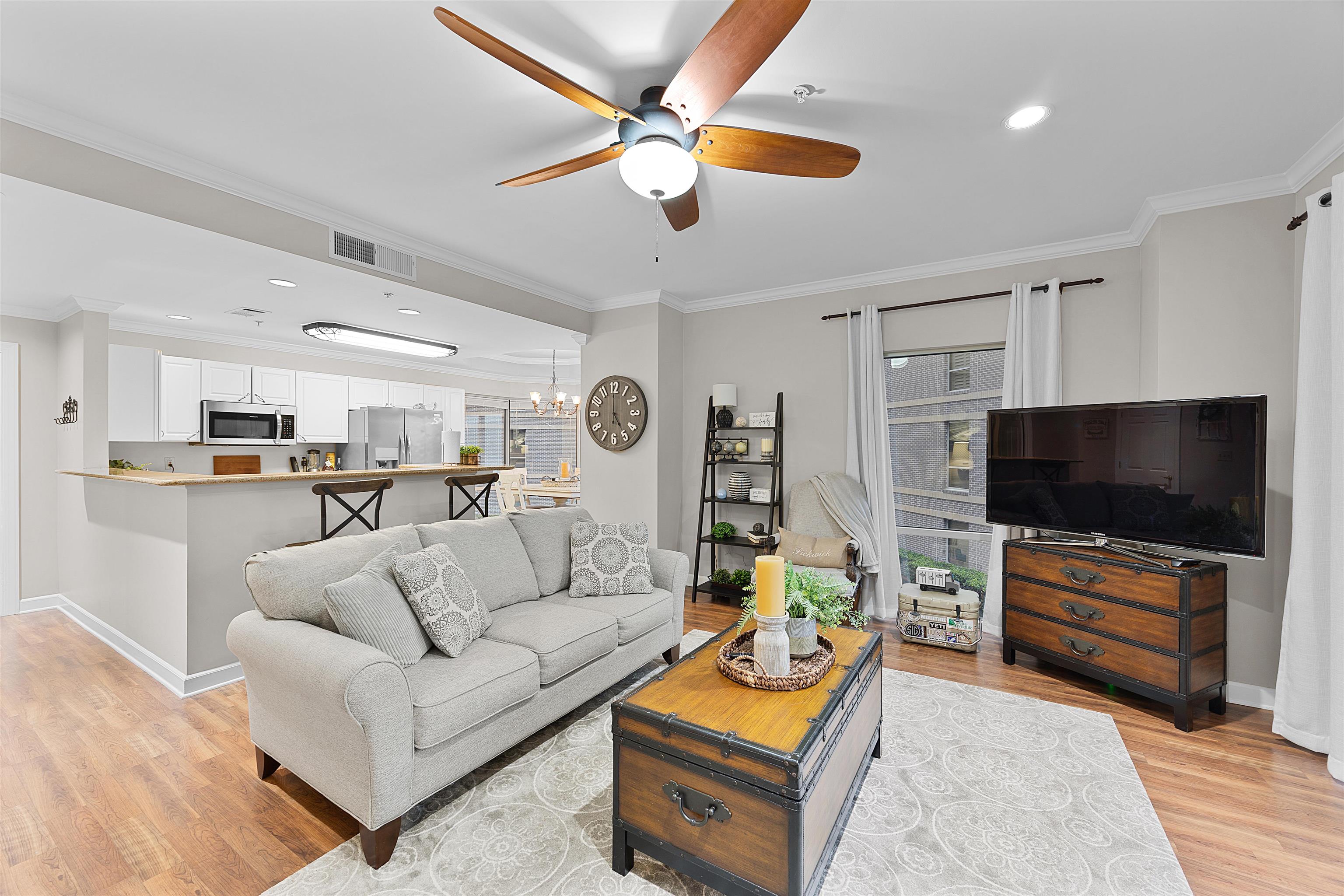 25 Cr 380 Road, Unit P 204 Iuka, MS 38852 - Photo 5 of 19 Living area with a ceiling fan, light wood-style floors, crown molding, a chandelier, and recessed lighting