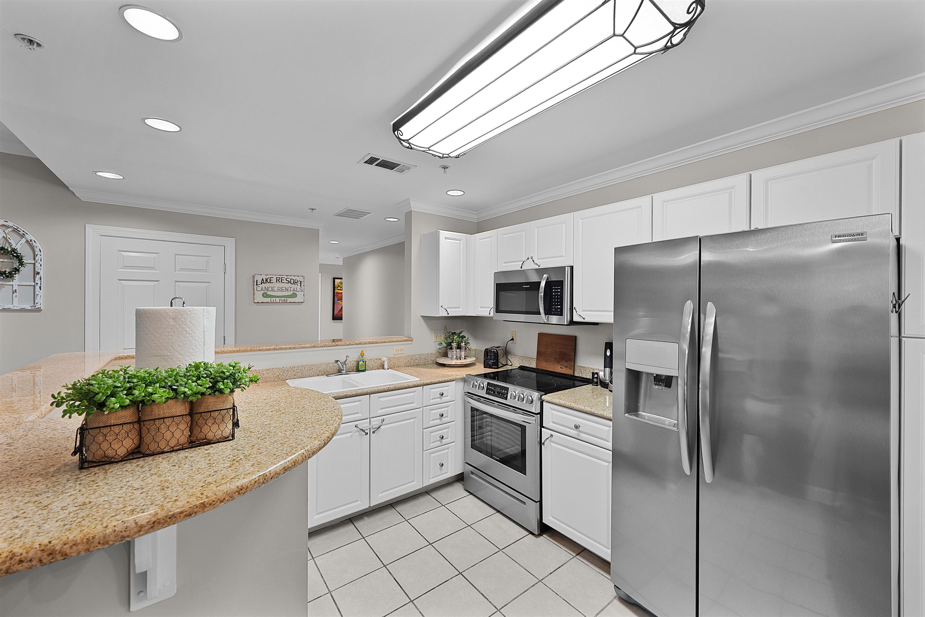 25 Cr 380 Road, Unit P 204 Iuka, MS 38852 - Photo 7 of 19 Kitchen featuring appliances with stainless steel finishes, ornamental molding, light tile patterned floors, white cabinets, and recessed lighting