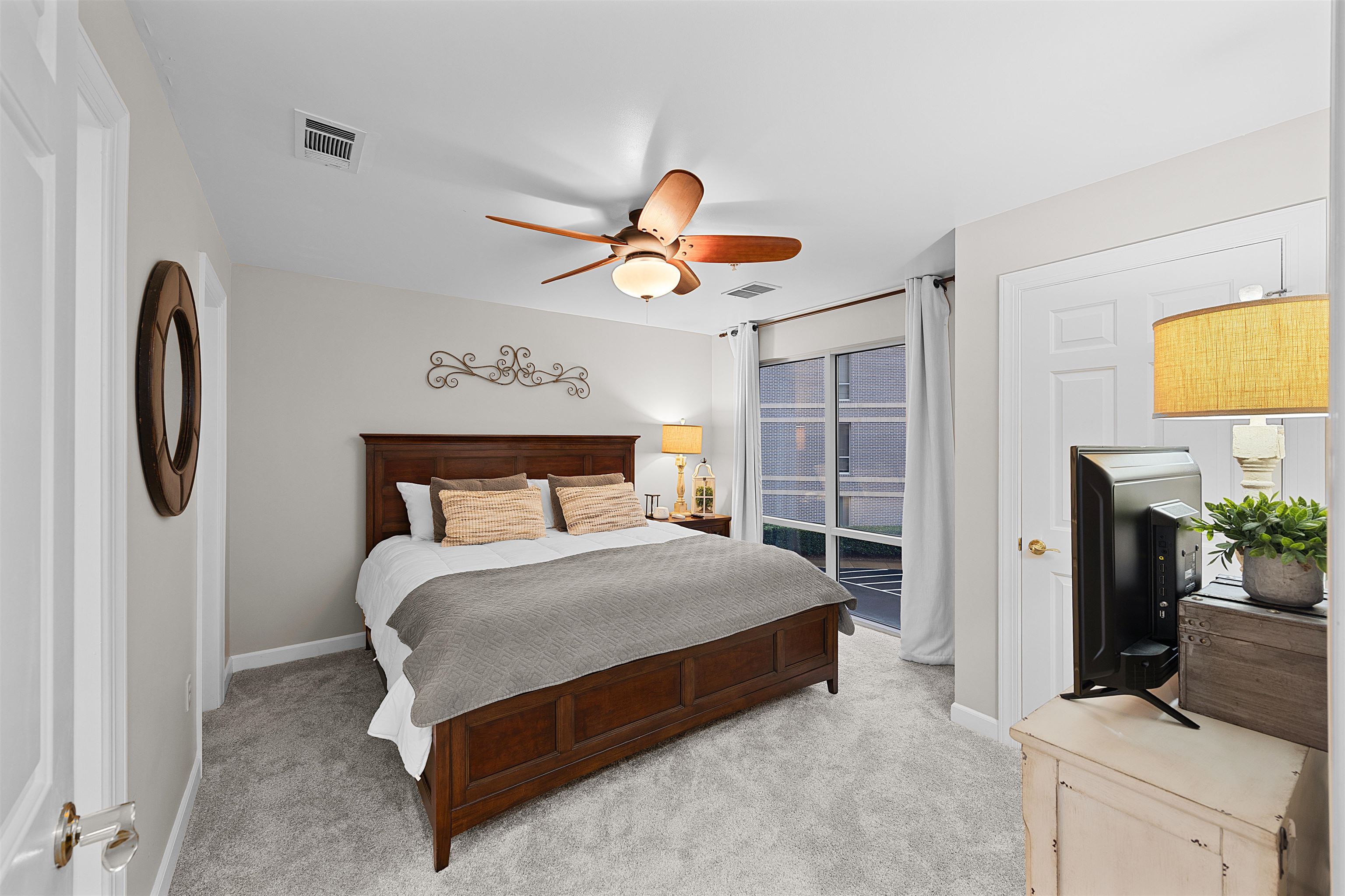 25 Cr 380 Road, Unit P 204 Iuka, MS 38852 - Photo 10 of 19 Bedroom featuring light colored carpet, a ceiling fan, and access to exterior