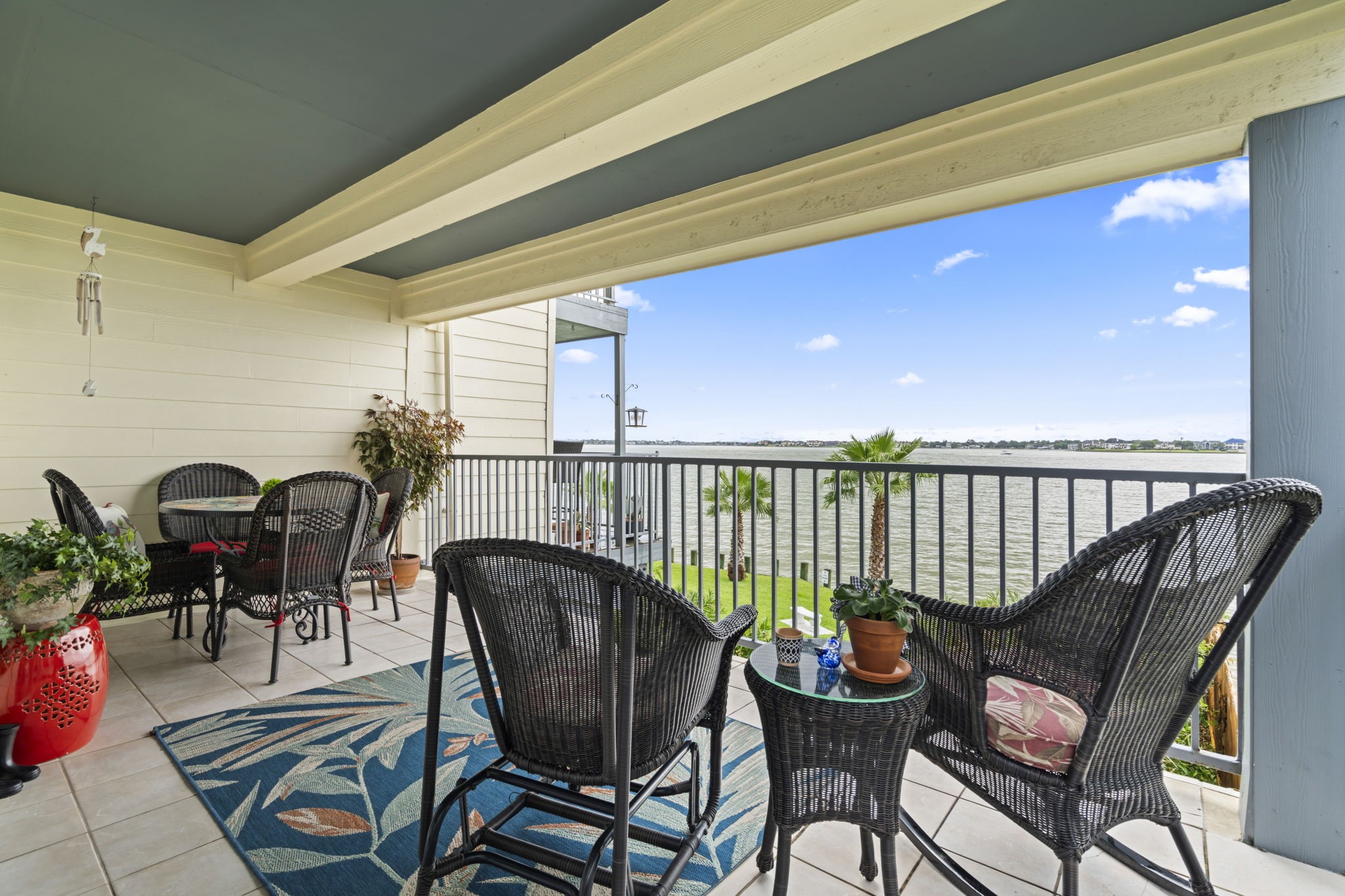 a balcony filled with furniture and rug