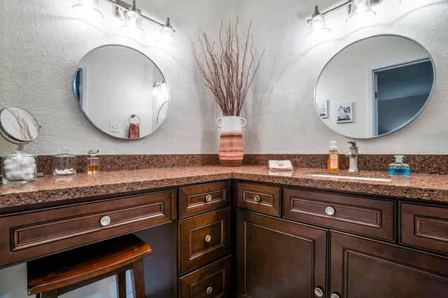 a kitchen with stainless steel appliances granite countertop a stove and a sink