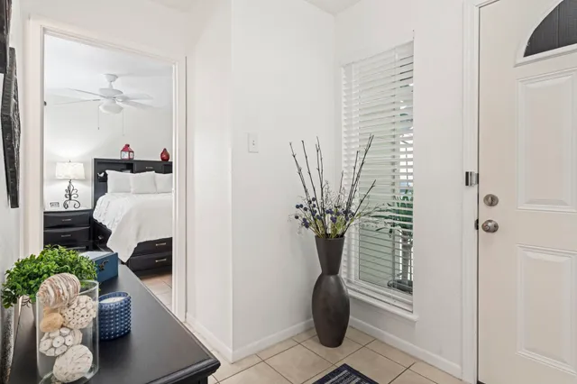 a bed room with a bed and a chandelier