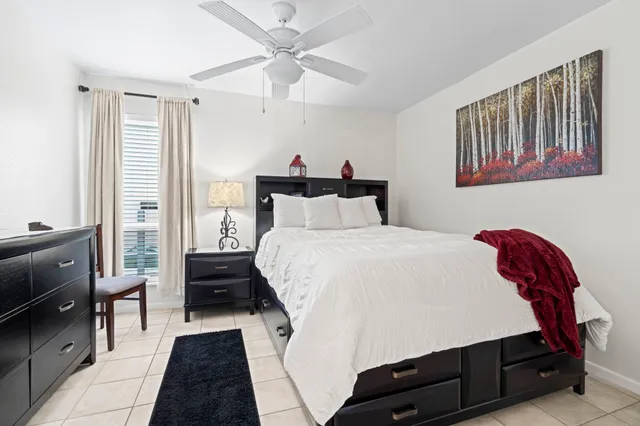 a bedroom with a bed and a dresser