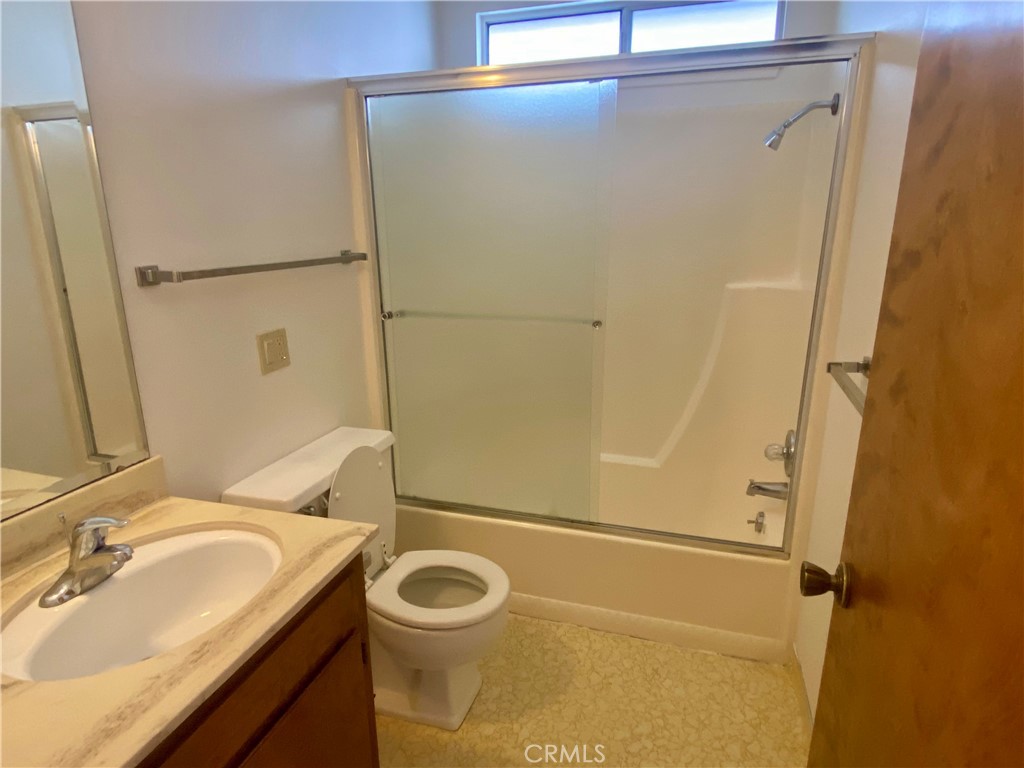 3219 Tide Avenue Morro Bay, CA 93442 - Photo 12 of 23 a bathroom with a sink and mirror