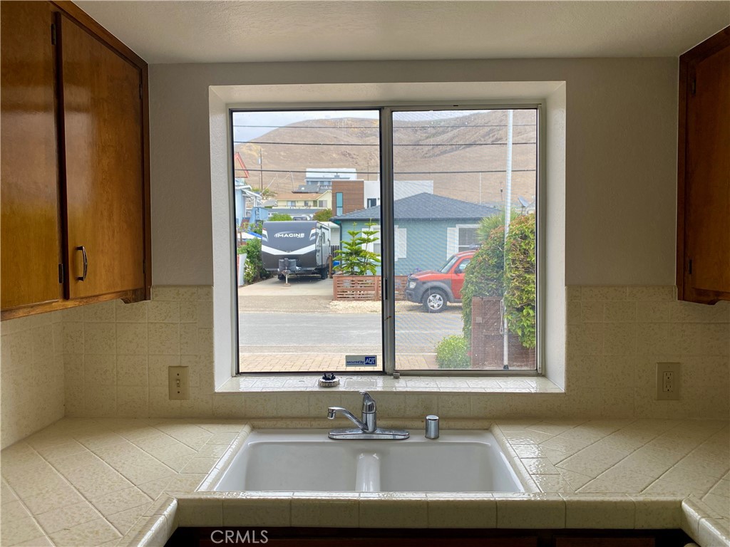 3219 Tide Avenue Morro Bay, CA 93442 - Photo 18 of 23 a view of a sink and a mirror