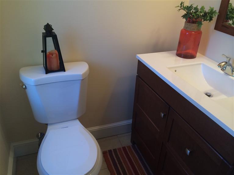 163 Guildford Road Centerville, MA 02632 - Photo 18 of 29 a bathroom with a toilet sink and mirror