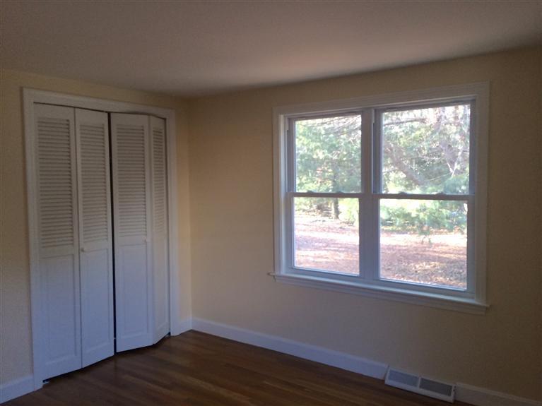 163 Guildford Road Centerville, MA 02632 - Photo 19 of 29 a view of an empty room with wooden floor and a window