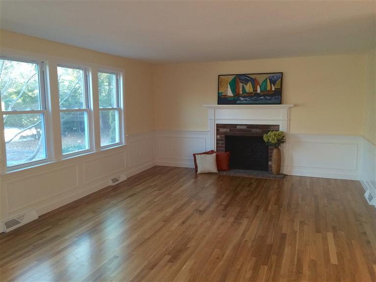 163 Guildford Road Centerville, MA 02632 - Photo 2 of 29 a view of empty room with wooden floor and fireplace