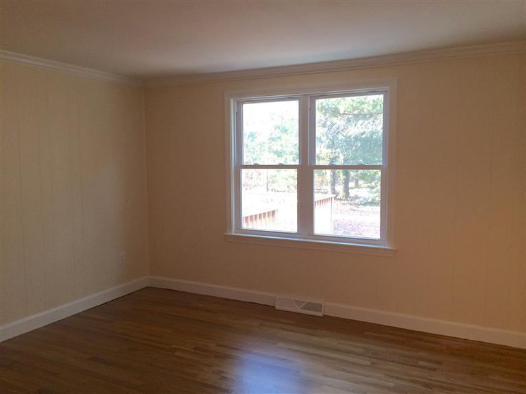 163 Guildford Road Centerville, MA 02632 - Photo 21 of 29 a view of an empty room with wooden floor and a window
