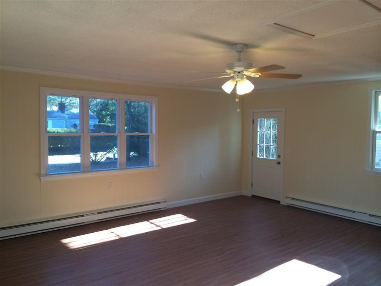 163 Guildford Road Centerville, MA 02632 - Photo 24 of 29 a view of an empty room with wooden floor and a window