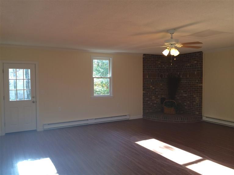 163 Guildford Road Centerville, MA 02632 - Photo 25 of 29 wooden floor in an empty room with a window