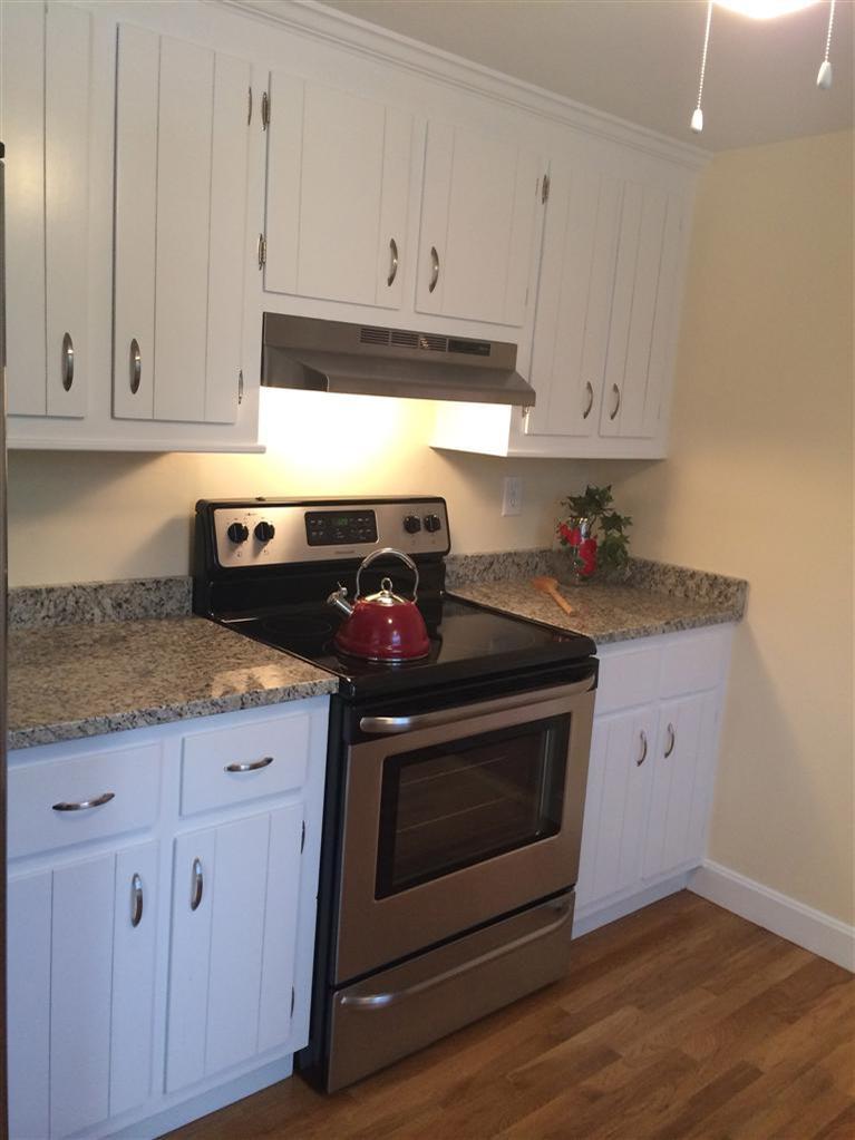 163 Guildford Road Centerville, MA 02632 - Photo 7 of 29 a stove top oven sitting inside of a kitchen