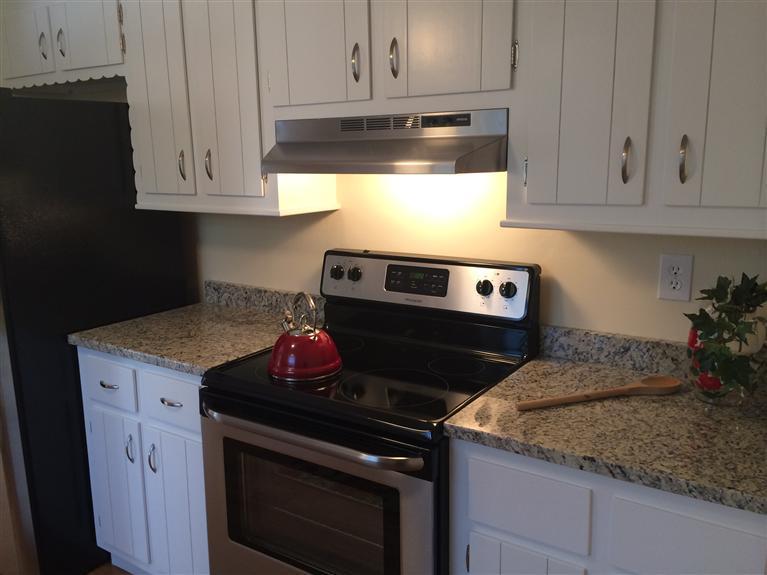 163 Guildford Road Centerville, MA 02632 - Photo 8 of 29 a kitchen with granite countertop cabinets and steel appliances
