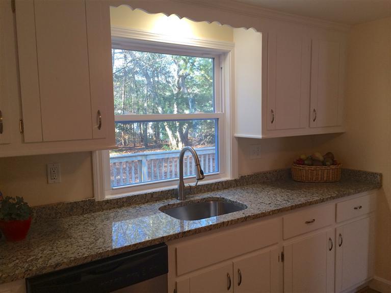 163 Guildford Road Centerville, MA 02632 - Photo 10 of 29 a kitchen with granite countertop a sink window and cabinets