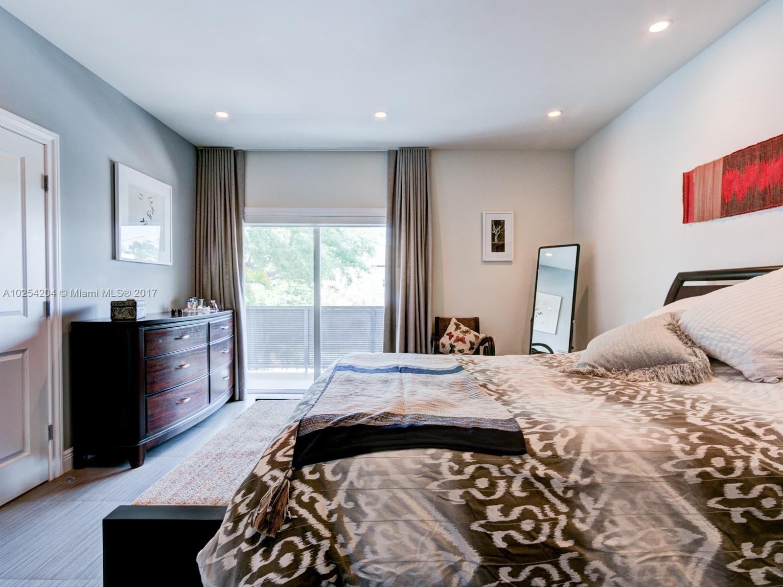 2993 Ruth Street, Unit 2993 Coconut Grove, FL 33133 - Photo 18 of 29 a bedroom with a bed and a dresser