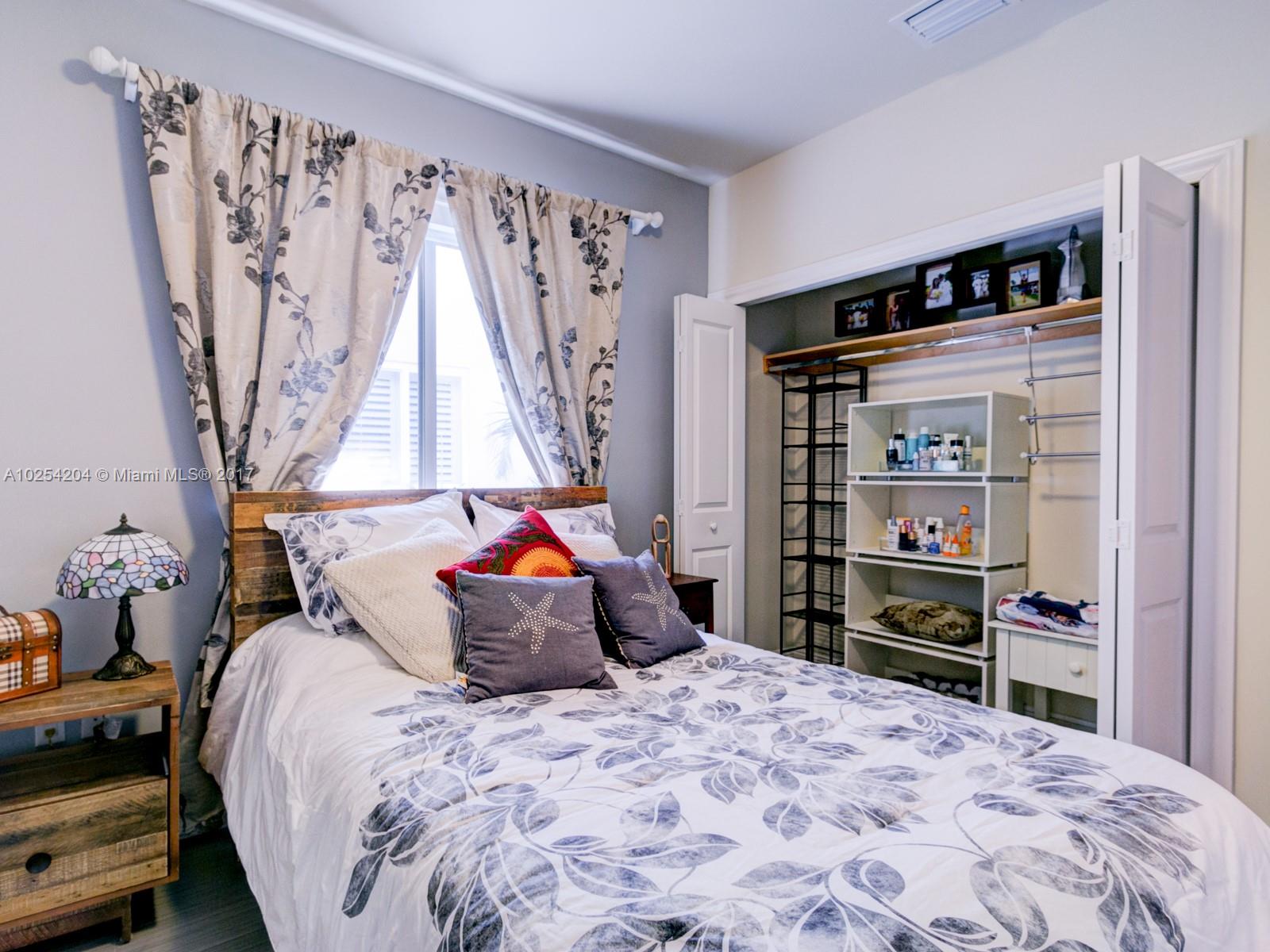 2993 Ruth Street, Unit 2993 Coconut Grove, FL 33133 - Photo 25 of 29 a bedroom with a bed and a closet