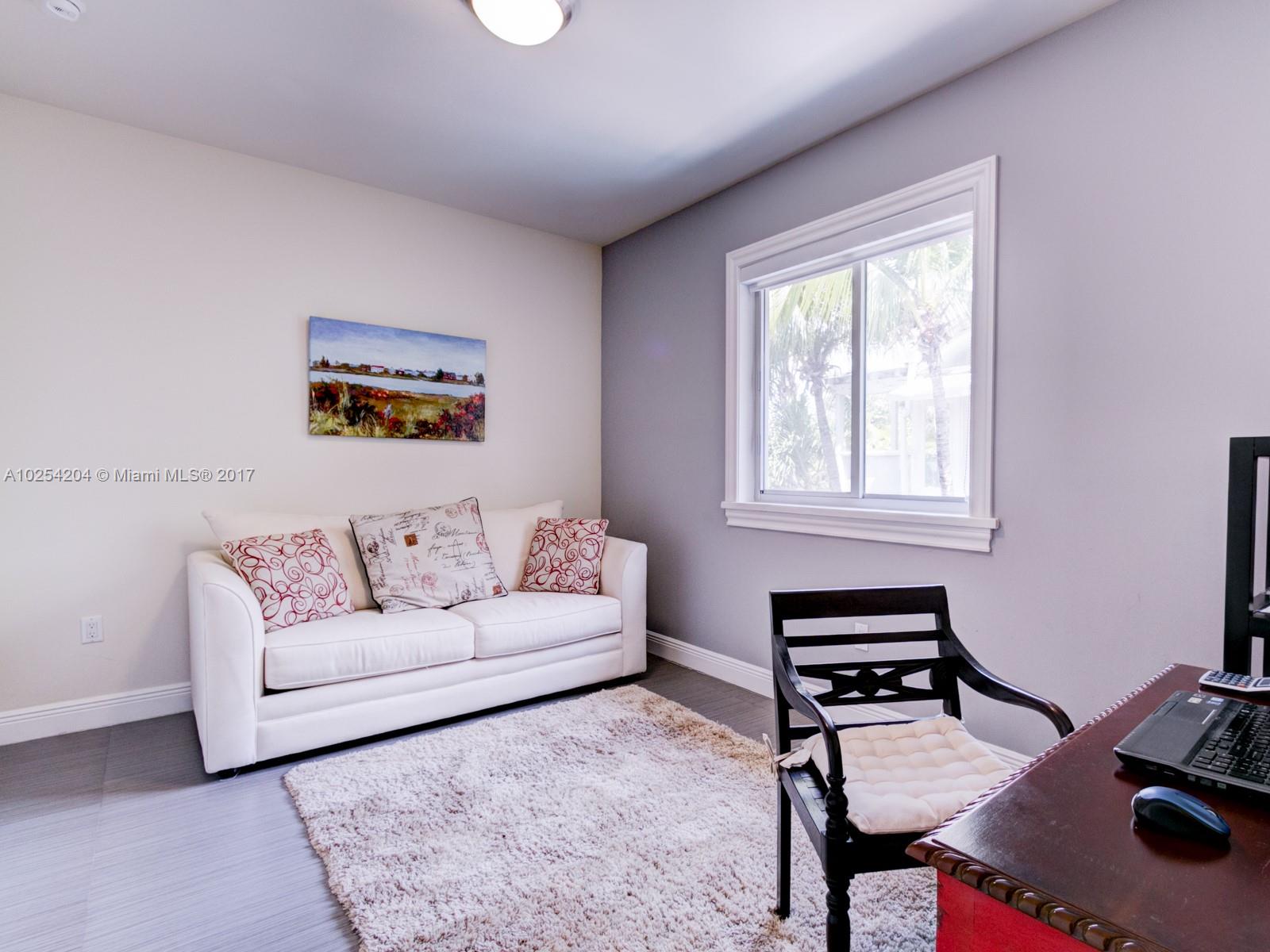 2993 Ruth Street, Unit 2993 Coconut Grove, FL 33133 - Photo 26 of 29 a living room with furniture and a window