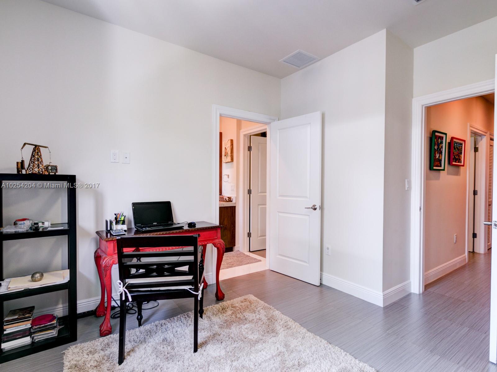 2993 Ruth Street, Unit 2993 Coconut Grove, FL 33133 - Photo 27 of 29 a view of a workspace with furniture and wooden floor